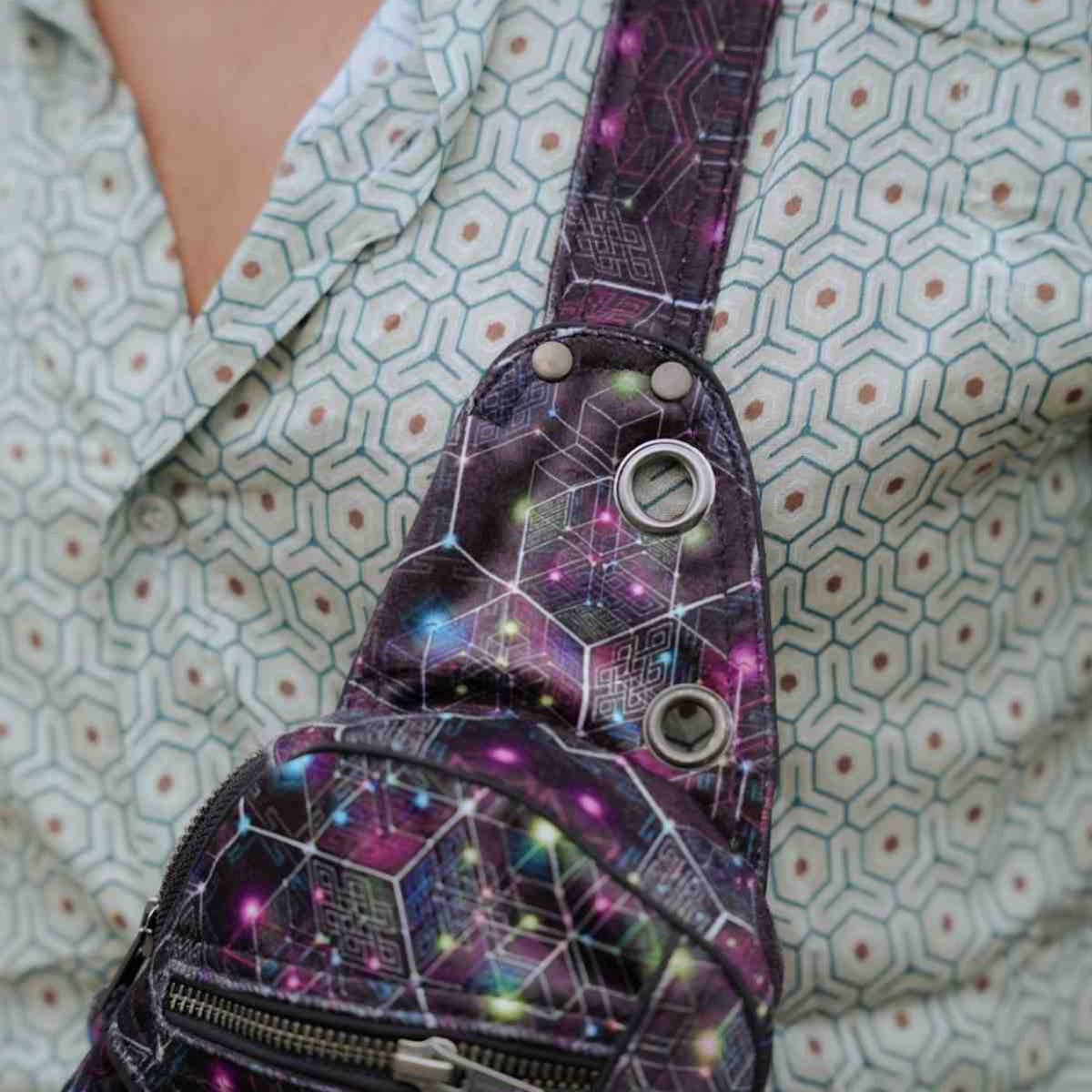 NEUROSOMATIC psychedelic festival sling bag showing front pockets and D-ring
