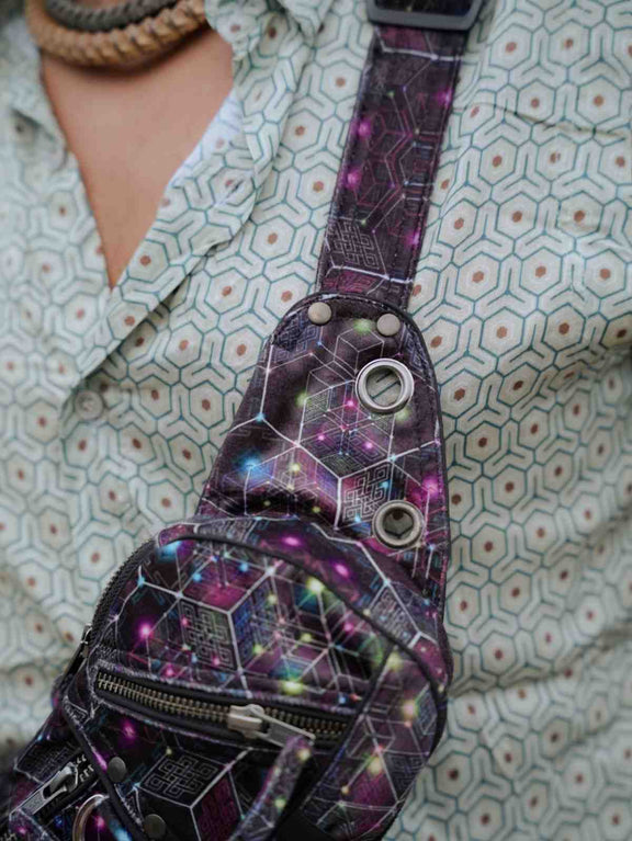 NEUROSOMATIC psychedelic festival sling bag showing front pockets and D-ring