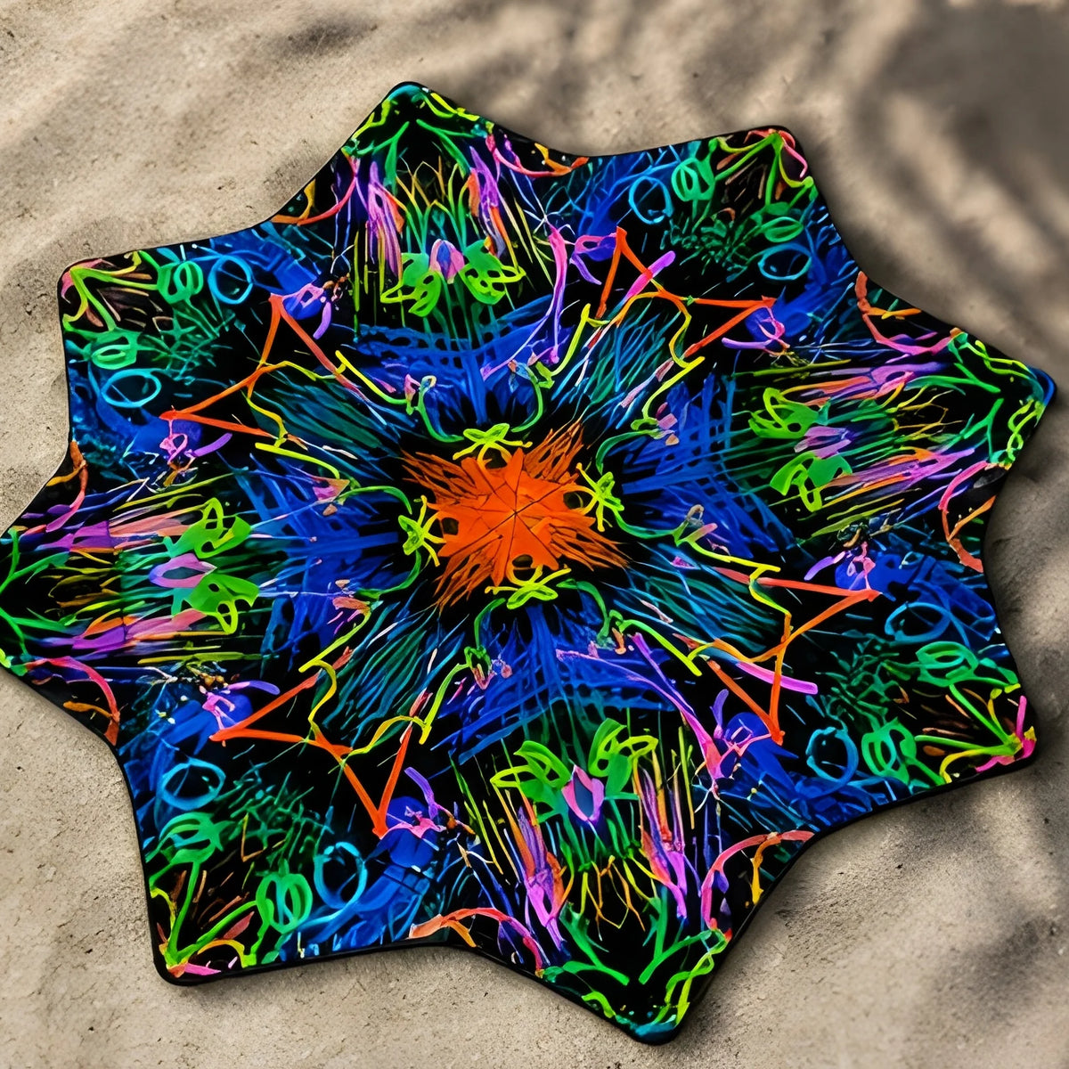 Neon Bloom DAPOSTAR spinning cloth on beach sand with identical double-sided psychedelic print
