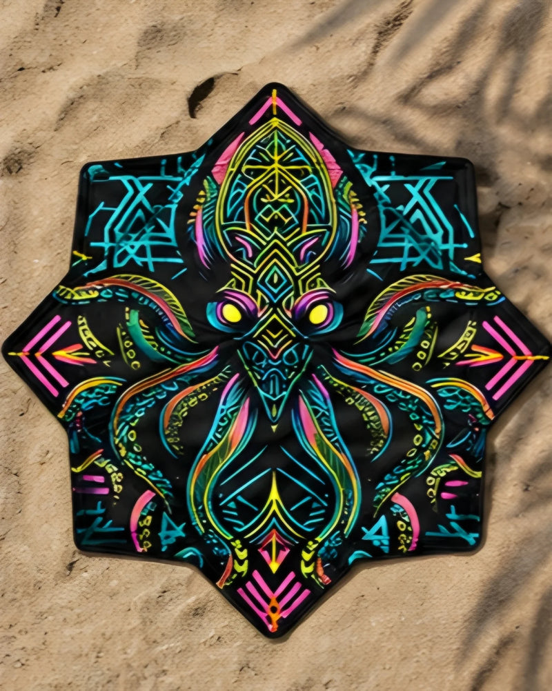 Neon Kraken DAPOSTAR spinning cloth displayed on sand, featuring UV reactive psychedelic festival artwork.