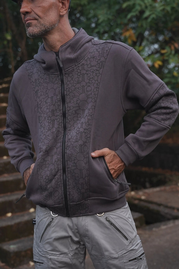 Fractal Gravity grey zip-up hoodie showing patterned front panels and zippered pockets