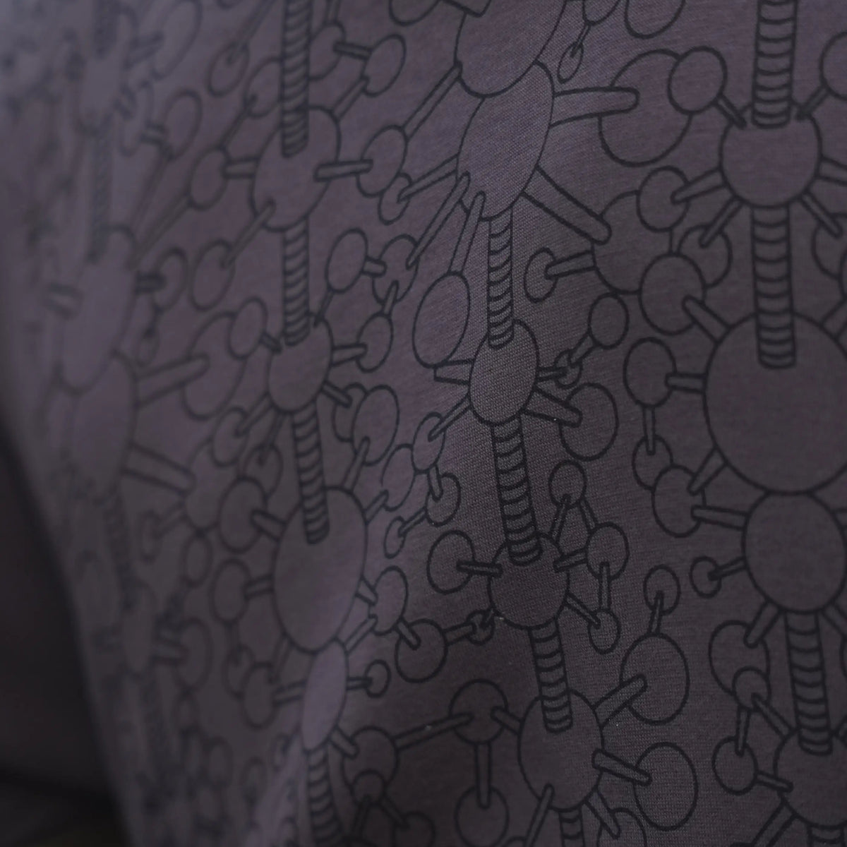 Tonal geometric linework on the grey Fractal Gravity hoodie fabric