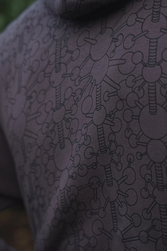 Tonal geometric linework on the grey Fractal Gravity hoodie fabric