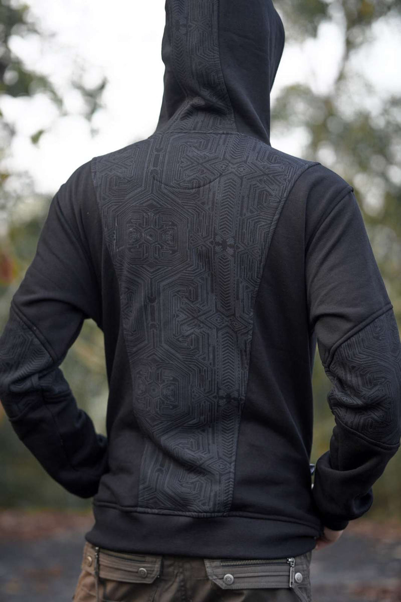 Back view of the Metanoia black hoodie displaying its full-length geometric back panel