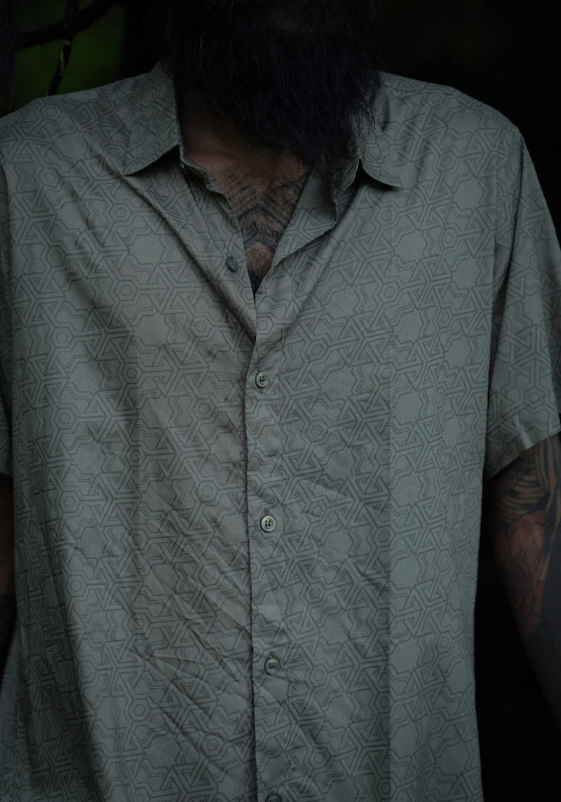 Close-up of olive khaki men's viscose shirt showcasing sacred geometry print and premium viscose fabric