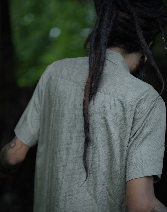 Back view of Pythagoras olive khaki men's viscose shirt displaying full sacred geometry artwork