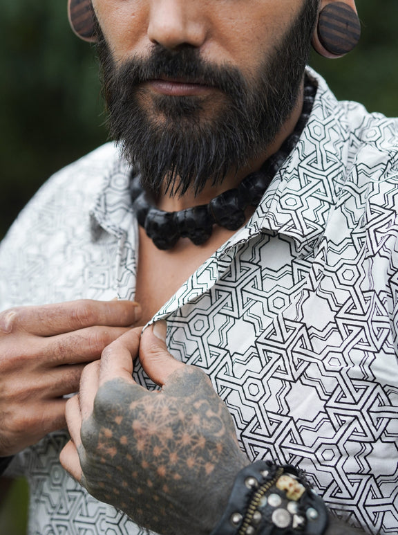 Close-up collar and button detail of Pythagoras white men's viscose shirt with geometric print