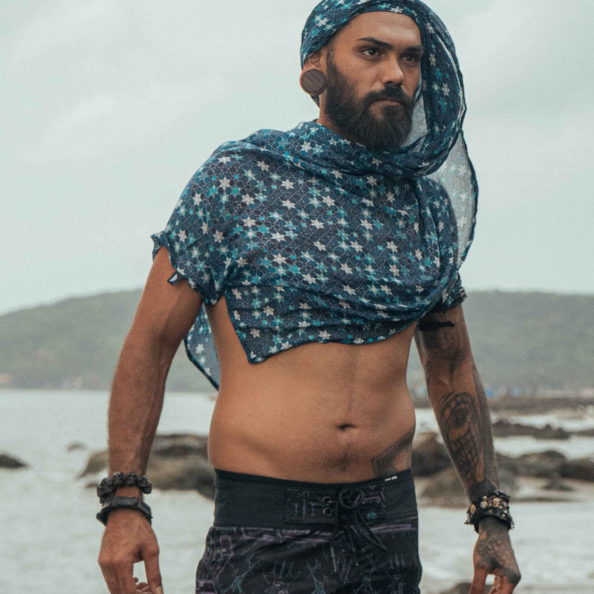 Realm of Metatron bamboo scarf featuring sacred geometry print worn as a hooded festival scarf