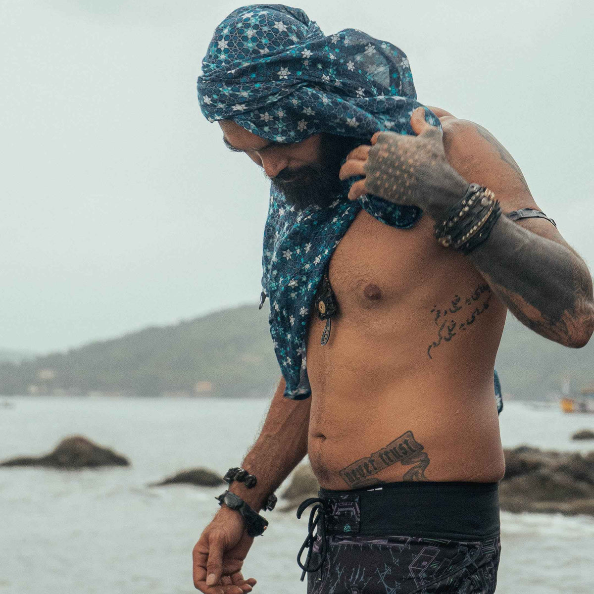 Realm of Metatron bamboo scarf with blue sacred geometry digital print styled as a shoulder wrap