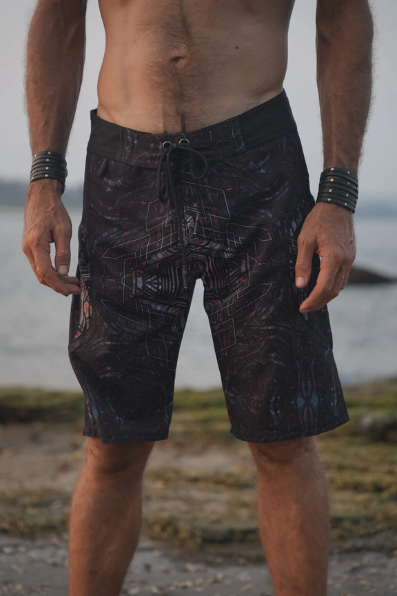 Star Dust psychedelic board shorts for men with a dark geometric print and adjustable drawstring waistband