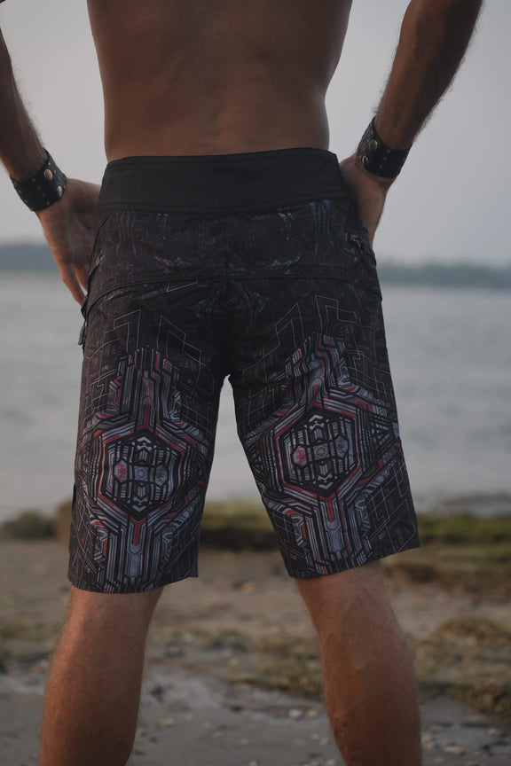 Rear three-quarter view of Star Dust men's printed board shorts showing the geometric pattern and longer cut