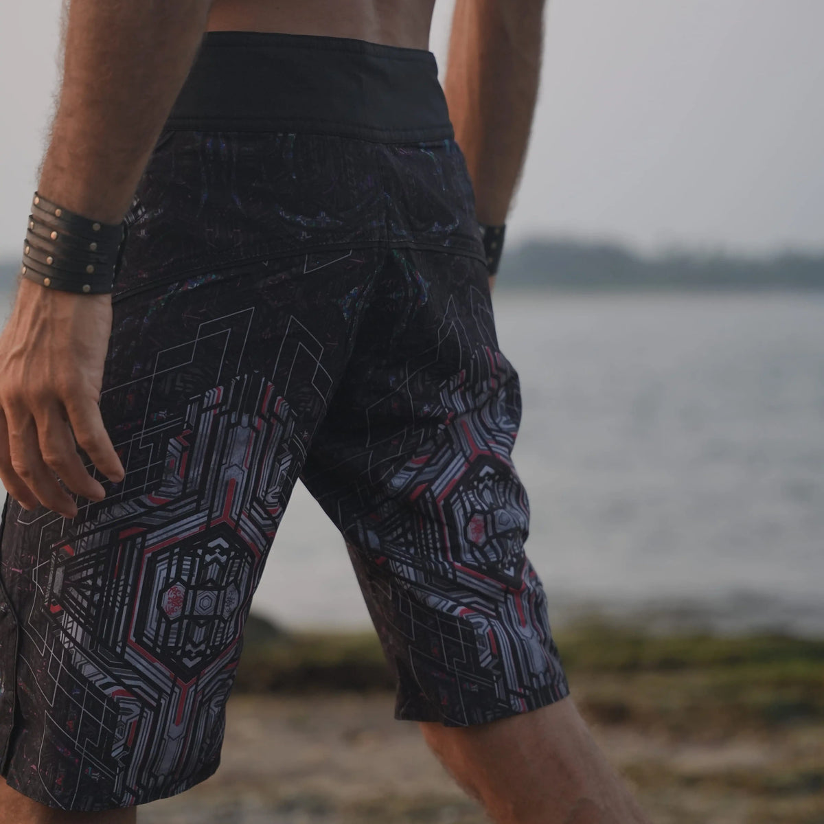 Side view of Star Dust printed board shorts highlighting the longer leg cut and geometric artwork
