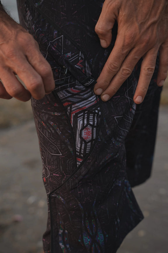 Close-up of Star Dust men's board shorts showing the dark geometric print and drawstring waistband