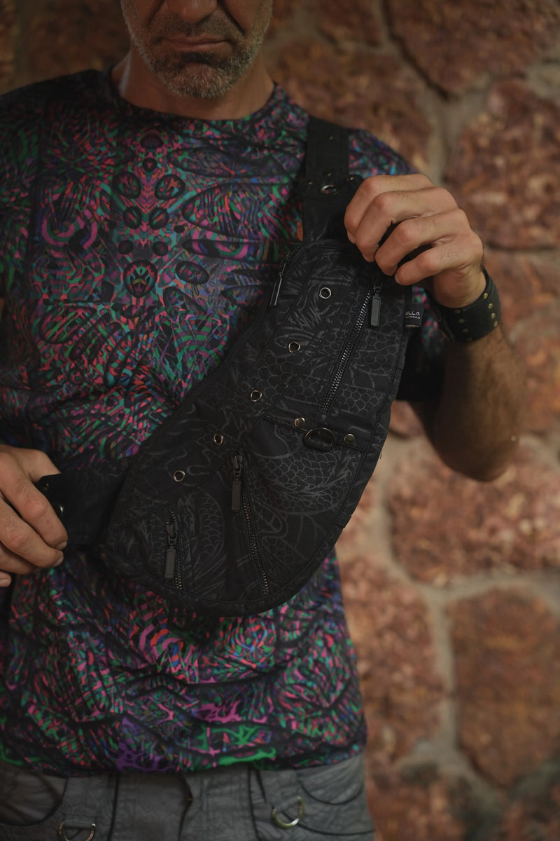 Vanta Dragon cotton canvas crossbody bag worn across the body with dark dragon-inspired artwork