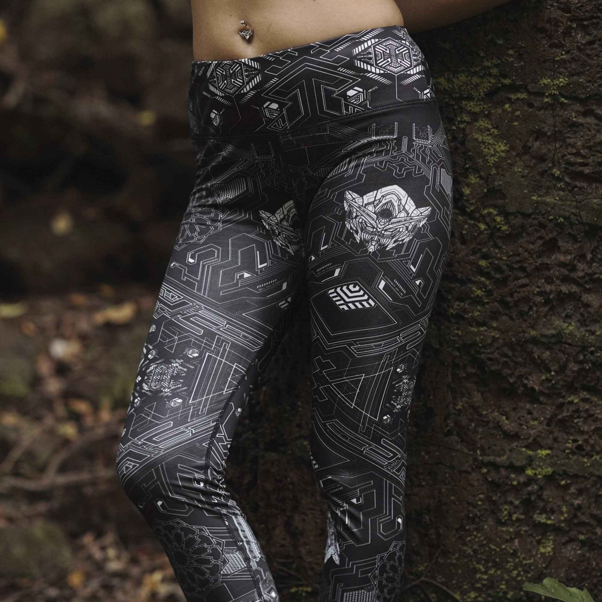 Source Code women's leggings featuring a black and white futuristic geometric print