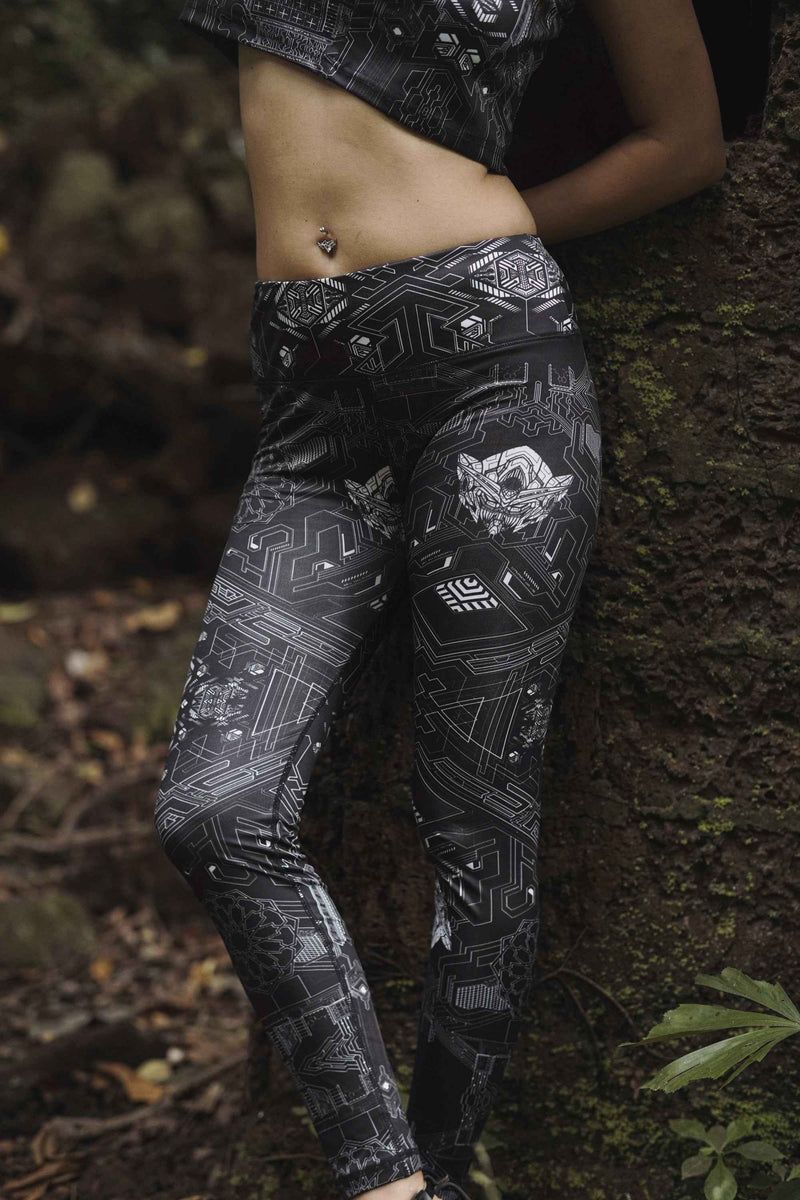 Source Code women's leggings featuring a black and white futuristic geometric print