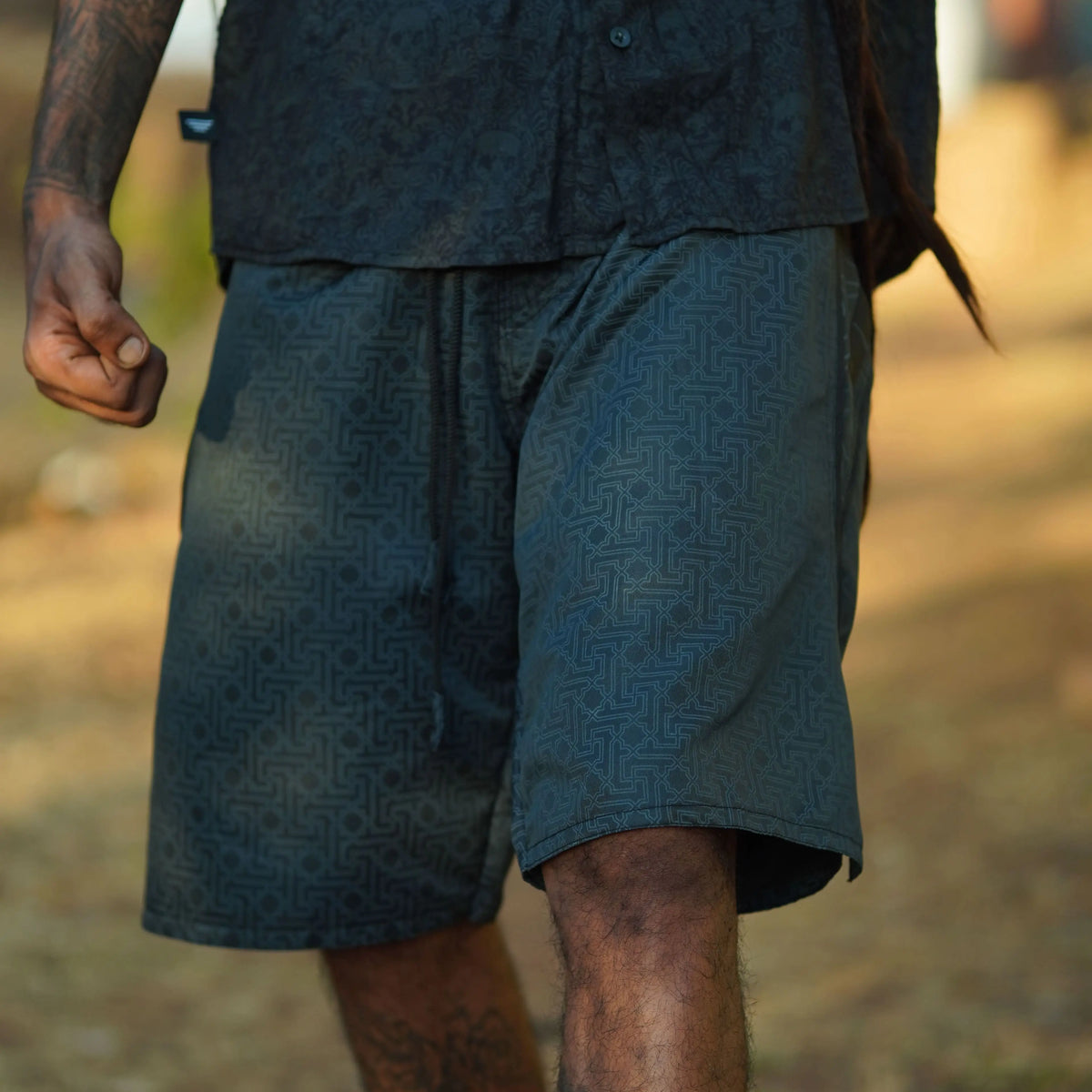 black geometric swim shorts for men yantra design front view
