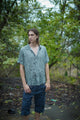 man wearing bamboo fabric shirt for men at outdoor festival setting
