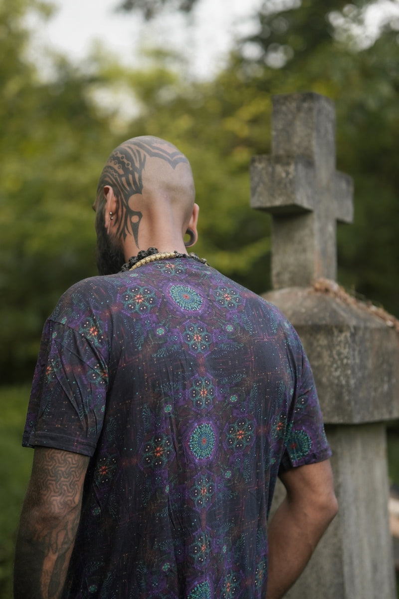 back view of psychedelic floral print t shirt with repeating sacred geometry design