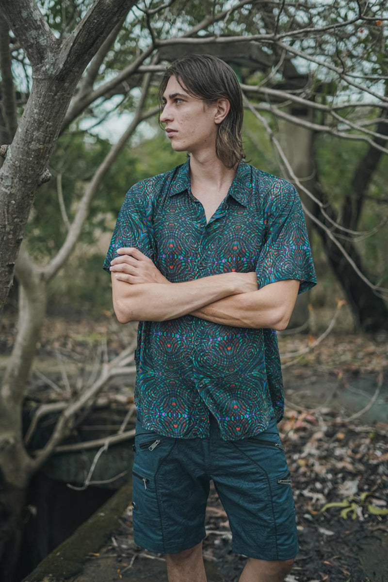 man wearing men’s bamboo shirt with psychedelic print outdoors