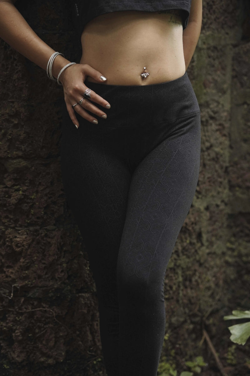 Magma Codex women's black leggings with subtle geometric screen print