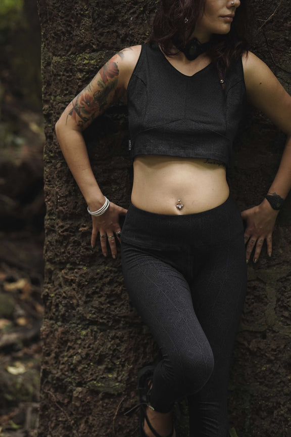 Woman wearing Magma Codex black screen-printed cotton lycra leggings