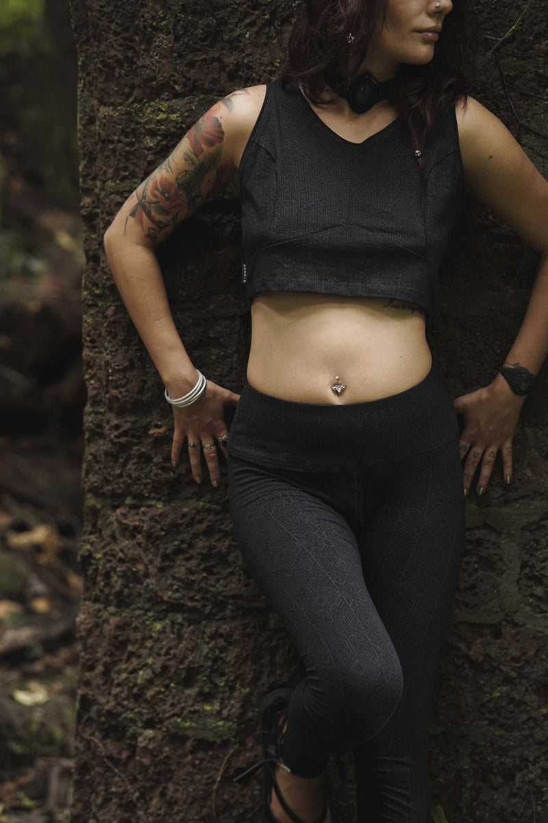 Woman wearing Magma Codex black screen-printed cotton lycra leggings